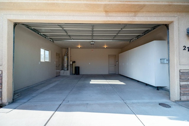 2710 W 410 N, Hurricane, UT 84737 - garage featuring secured water heater