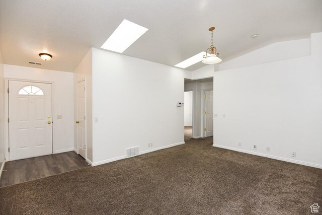 635 E Hunter Way N, Grantsville, UT 84029 - entryway with a skylight, dark carpet, vaulted ceiling, and baseboards