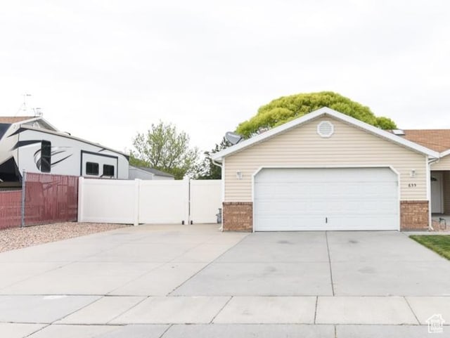 635 E Hunter Way N, Grantsville, UT 84029 - garage featuring concrete driveway