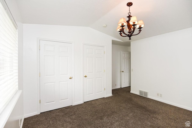 635 E Hunter Way N, Grantsville, UT 84029 - unfurnished bedroom featuring a chandelier, vaulted ceiling, dark carpet, and baseboards