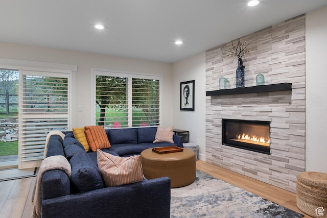 1288 E Foxcrest Ct, Park City, UT 84098 - living room featuring a stone fireplace, wood finished floors, and recessed lighting