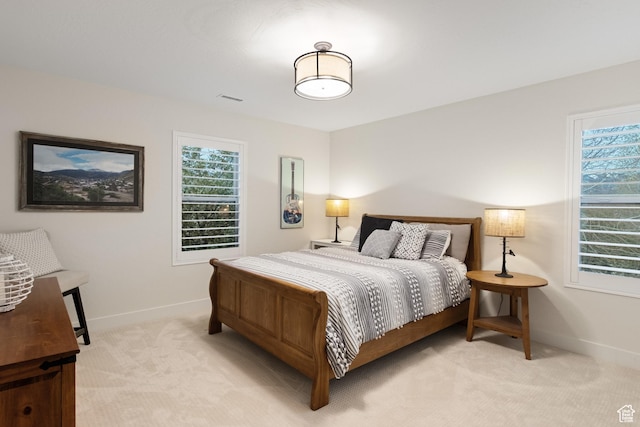 1288 E Foxcrest Ct, Park City, UT 84098 - bedroom with light carpet, baseboards, and multiple windows