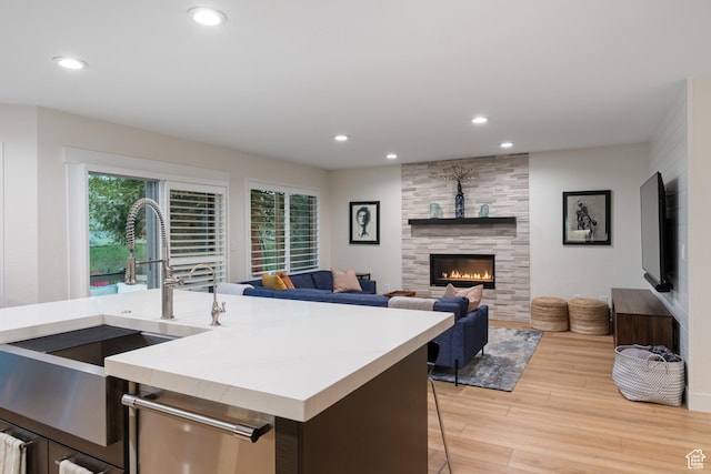 1288 E Foxcrest Ct, Park City, UT 84098 - kitchen featuring light wood finished floors, a sink, plenty of natural light, light countertops, and recessed lighting