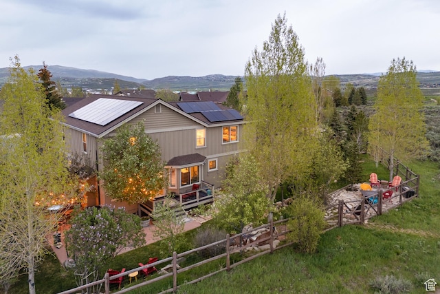 1288 E Foxcrest Ct, Park City, UT 84098 - rear view of property featuring roof mounted solar panels and a deck with mountain view