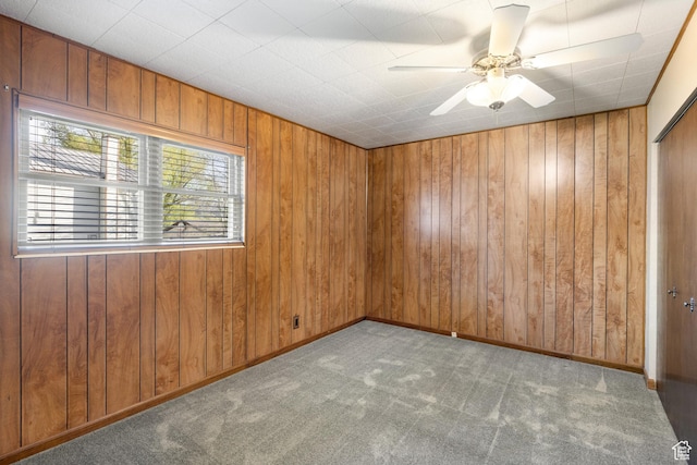 5685 N State Road 32, Peoa, UT 84061 - spare room featuring carpet flooring, wooden walls, and ceiling fan