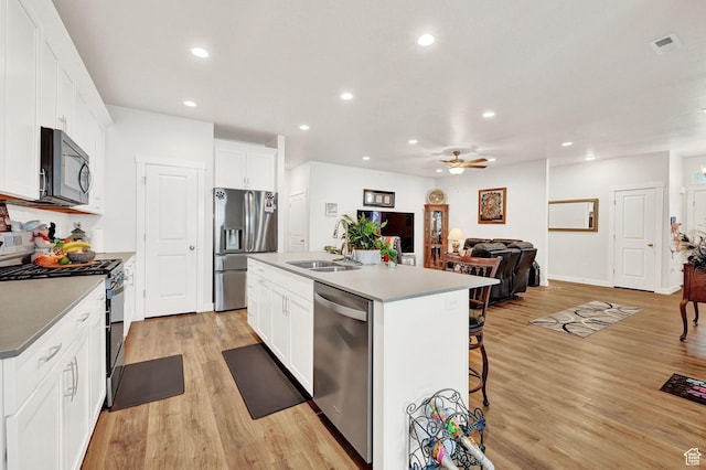 114 N 3830 W, West Point, UT 84015 - kitchen featuring appliances with stainless steel finishes, a sink, recessed lighting, ceiling fan, and light wood-style floors