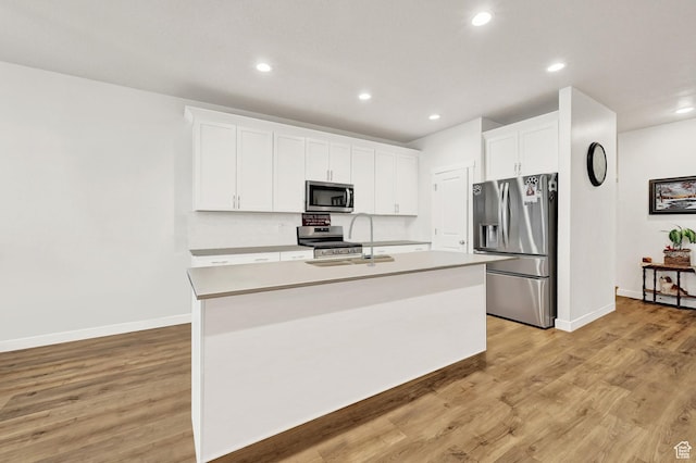 114 N 3830 W, West Point, UT 84015 - kitchen featuring stainless steel appliances, a sink, white cabinetry, a center island with sink, and recessed lighting