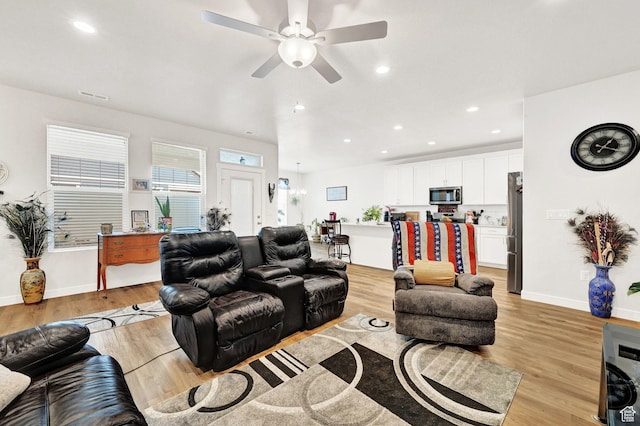 114 N 3830 W, West Point, UT 84015 - living area with light wood-type flooring, a ceiling fan, recessed lighting, and baseboards