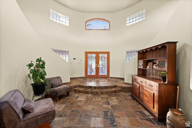 9266 Par Ct, Park City, UT 84098 - foyer with stone tile flooring, french doors, plenty of natural light, and a high ceiling