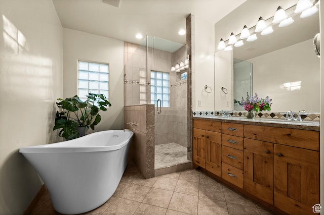 9266 Par Ct, Park City, UT 84098 - bathroom featuring a shower stall, a freestanding tub, double vanity, and tile patterned floors