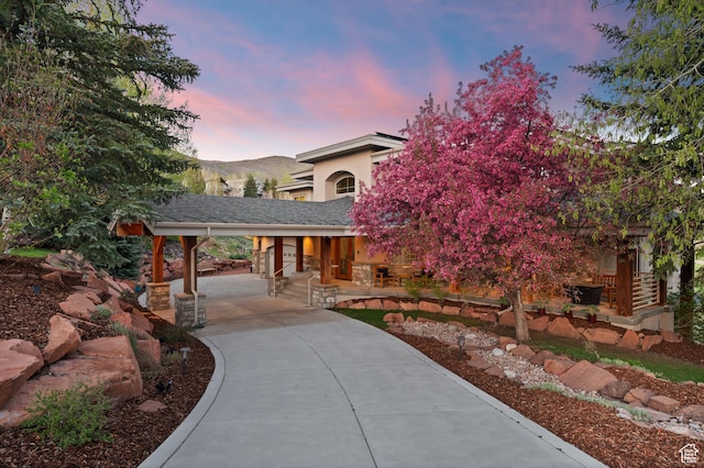 9266 Par Ct, Park City, UT 84098 - view of front of home with driveway, covered porch, stucco siding, and a carport