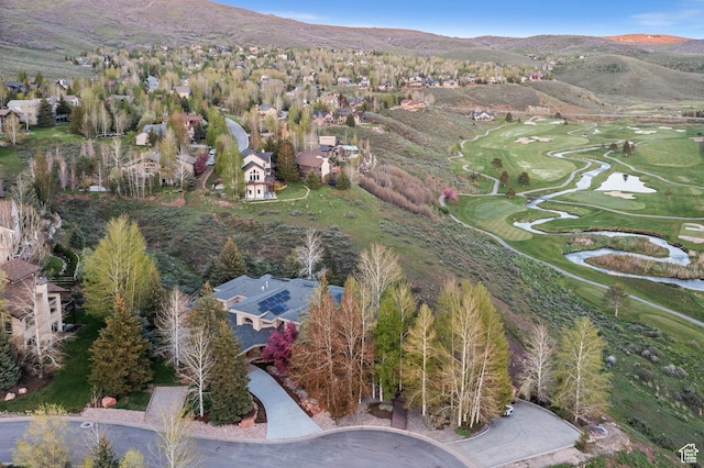 9266 Par Ct, Park City, UT 84098 - aerial overview of property's location featuring a golf course, a mountainous background, and nearby suburban area