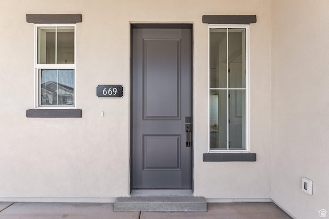 669 Juniper Hill Dr, St George, UT 84790 - entrance to property with stucco siding