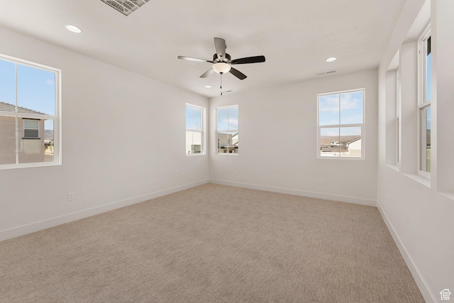 669 Juniper Hill Dr, St George, UT 84790 - spare room with healthy amount of natural light, light colored carpet, recessed lighting, and baseboards