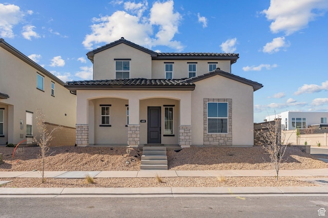 669 Juniper Hill Dr, St George, UT 84790 - mediterranean / spanish house featuring stucco siding, covered porch, and a tiled roof