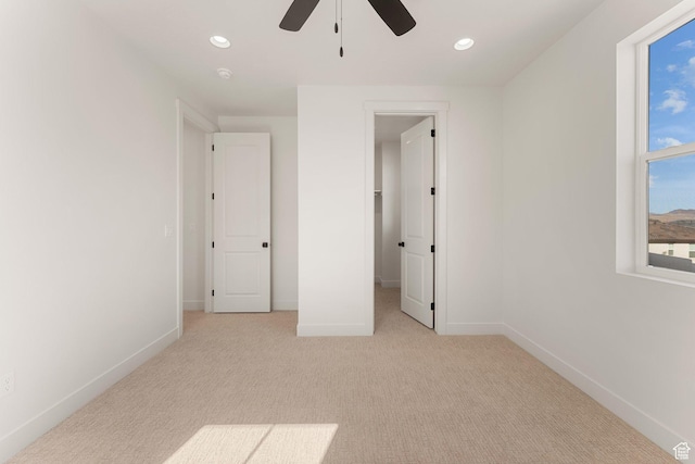 669 Juniper Hill Dr, St George, UT 84790 - unfurnished bedroom featuring carpet flooring, baseboards, recessed lighting, a ceiling fan, and a spacious closet