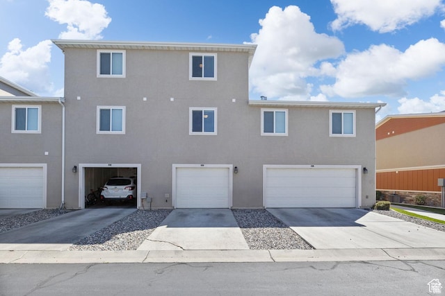 236 E 630 N, Vineyard, UT 84059 - back of property with stucco siding, an attached garage, and driveway