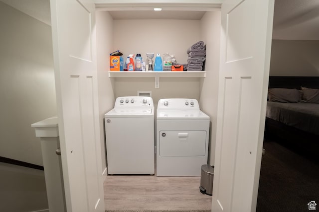2729 W Linwood Ct, Salt Lake City, UT 84129 - laundry area with washer and clothes dryer and light wood-style flooring