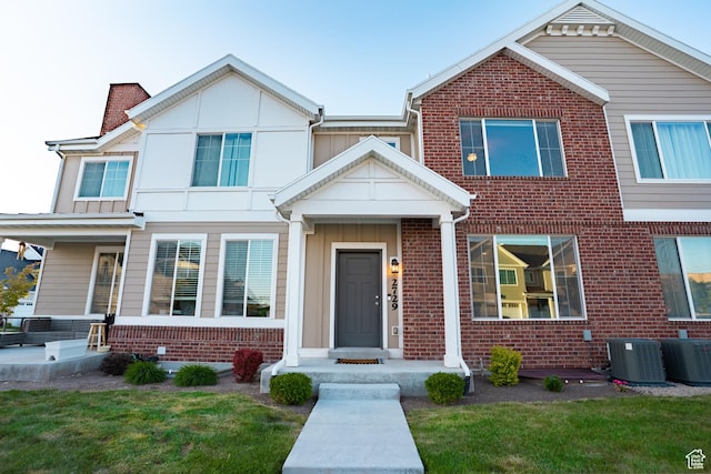 2729 W Linwood Ct, Salt Lake City, UT 84129 - multi unit property with brick siding, central AC, board and batten siding, and a front lawn