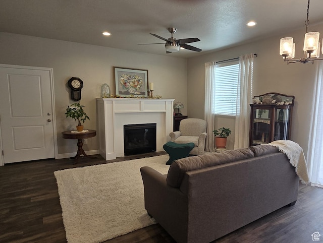250 W 1200 S Unit 127, Tremonton, UT 84337 - living area with dark wood-style flooring, a chandelier, ceiling fan, recessed lighting, and a fireplace with flush hearth