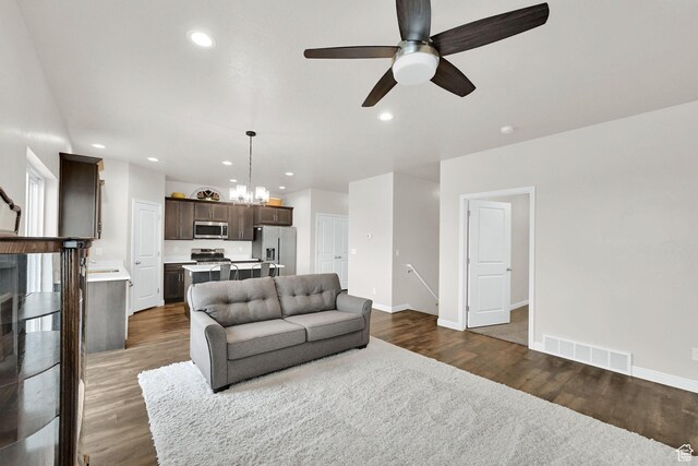 250 W 1200 S Unit 127, Tremonton, UT 84337 - living room featuring a ceiling fan, dark wood finished floors, recessed lighting, and a chandelier