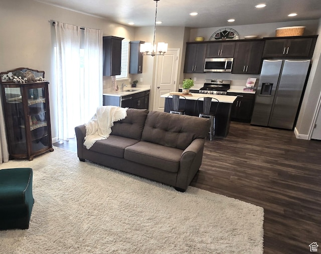 250 W 1200 S Unit 127, Tremonton, UT 84337 - living area with a chandelier, recessed lighting, and dark wood-type flooring