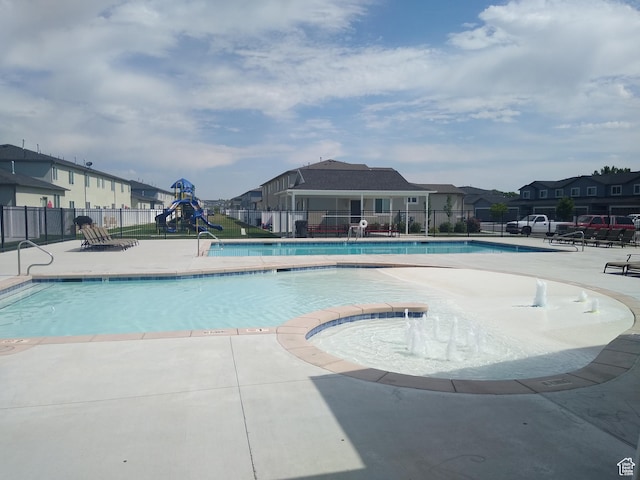 250 W 1200 S Unit 127, Tremonton, UT 84337 - community pool featuring a residential view, a jacuzzi, and a patio area