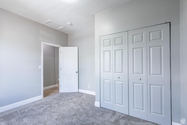 2665 S 8900 W, Magna, UT 84044 - unfurnished bedroom featuring attic access, carpet, a closet, and baseboards