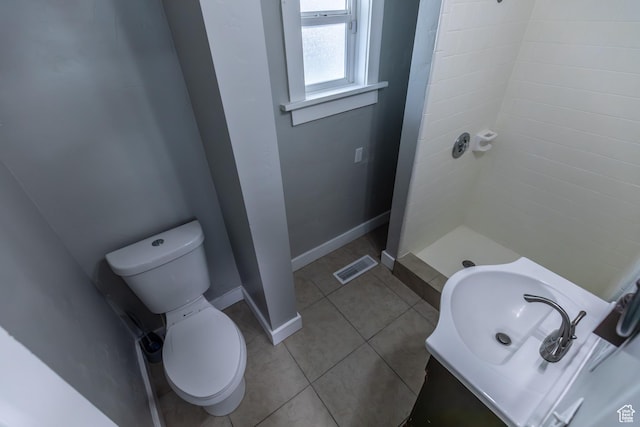 2665 S 8900 W, Magna, UT 84044 - full bath with baseboards, a stall shower, toilet, tile patterned floors, and a sink