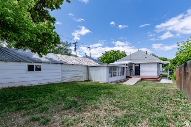 2665 S 8900 W, Magna, UT 84044 - rear view of property featuring a sunroom and a wooden deck