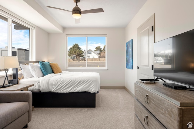 35 E 150 S Unit 202C, Garden City, UT 84028 - bedroom with baseboards, multiple windows, light carpet, and ceiling fan