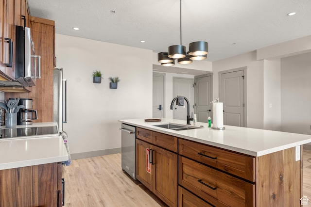 35 E 150 S Unit 202C, Garden City, UT 84028 - kitchen featuring a sink, brown cabinets, light wood-style flooring, light countertops, and recessed lighting