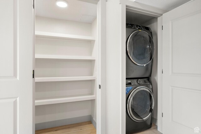 35 E 150 S Unit 202C, Garden City, UT 84028 - laundry area with stacked washer / drying machine and wood finished floors
