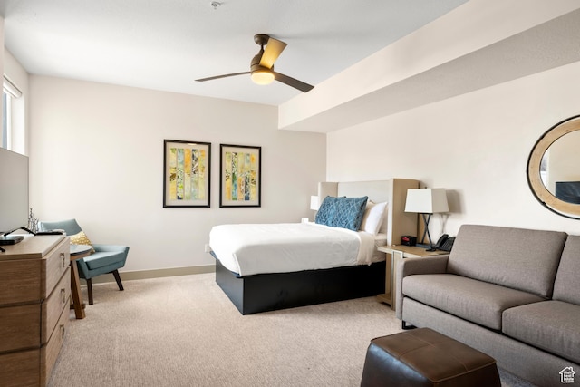35 E 150 S Unit 202C, Garden City, UT 84028 - bedroom featuring light colored carpet, ceiling fan, and baseboards