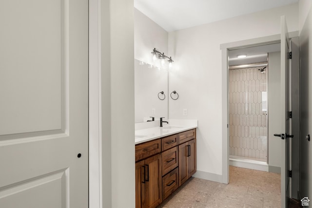 35 E 150 S Unit 202C, Garden City, UT 84028 - bathroom with a shower stall, double vanity, baseboards, and tile patterned flooring