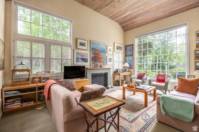 carpeted living area featuring wooden ceiling, lofted ceiling, and a fireplace