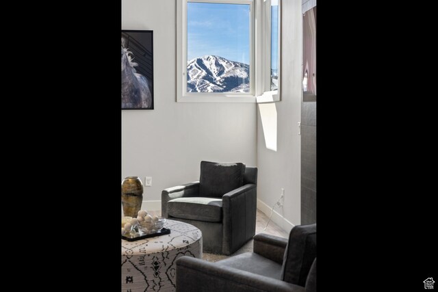 363 E Overlook Loop E Unit 22, Hideout, UT 84036 - living area featuring plenty of natural light and baseboards