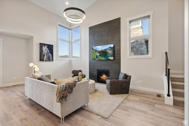363 E Overlook Loop E Unit 22, Hideout, UT 84036 - living room with a fireplace, wood finished floors, and baseboards