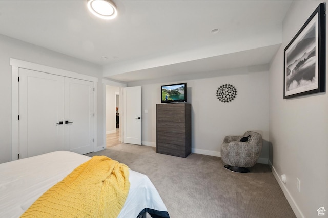 363 E Overlook Loop E Unit 22, Hideout, UT 84036 - bedroom featuring light colored carpet, baseboards, and a closet