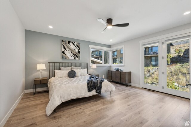363 E Overlook Loop E Unit 22, Hideout, UT 84036 - bedroom with access to exterior, wood finished floors, multiple windows, and recessed lighting