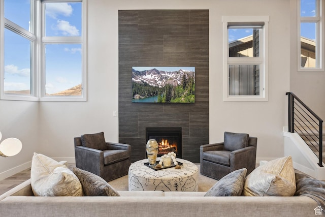 363 E Overlook Loop E Unit 22, Hideout, UT 84036 - living area featuring a fireplace, baseboards, and wood finished floors