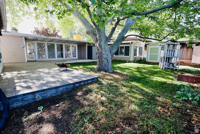 back of property featuring a patio and a yard