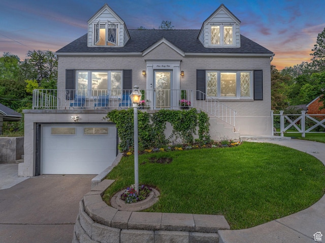 941 S Connor St E, Salt Lake City, UT 84108 - view of front facade with a garage, driveway, brick siding, and a shingled roof