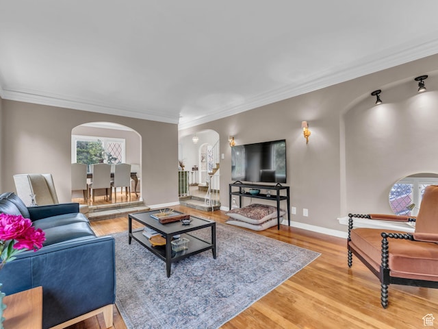 941 S Connor St E, Salt Lake City, UT 84108 - living area with arched walkways, light wood-style floors, ornamental molding, and baseboards