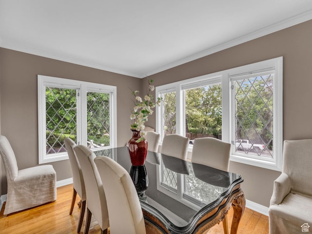 941 S Connor St E, Salt Lake City, UT 84108 - dining room featuring healthy amount of natural light, light wood-style floors, baseboards, and ornamental molding