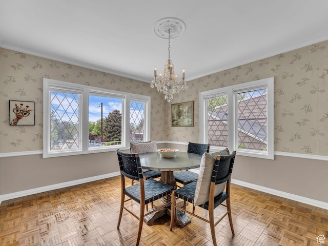941 S Connor St E, Salt Lake City, UT 84108 - dining area featuring a chandelier, plenty of natural light, baseboards, wallpapered walls, and ornamental molding
