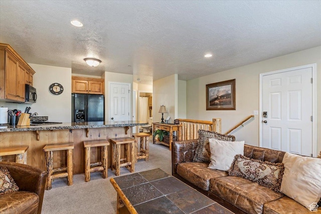 3521 N Fox Run Unit 812, Eden, UT 84310 - living area with light carpet, a textured ceiling, and recessed lighting