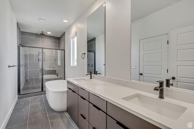 6904 W Lake Ave S Unit 213, South Jordan, UT 84009 - bathroom with a shower stall, baseboards, a freestanding tub, double vanity, and tile patterned floors