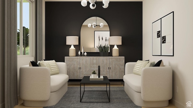 living area with a chandelier and healthy amount of natural light