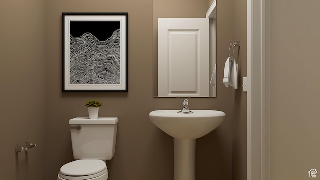 half bathroom with toilet and a sink
